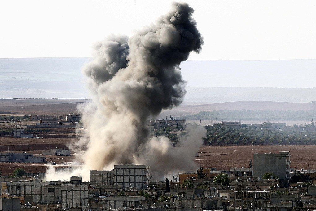 Smoke rises after a US airstrike on Islamic State positions in the besieged Syrian town of Kobane. Photo: Xinhua