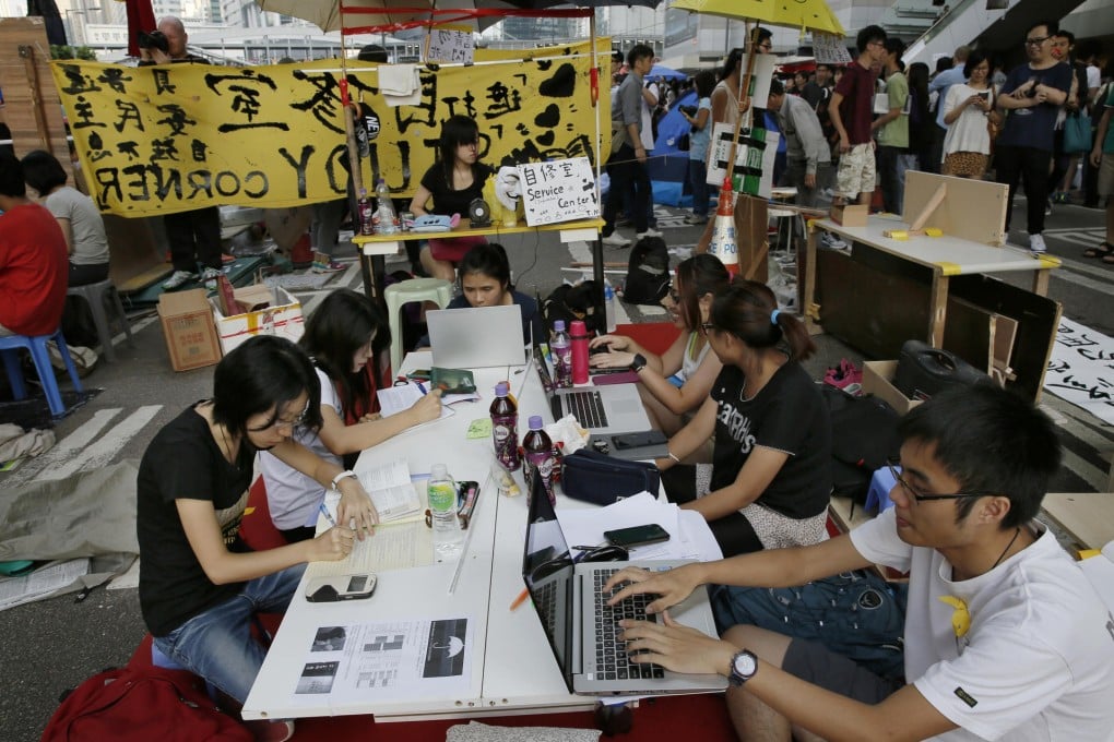 Pro-democracy students do their homework at a study area. Photo: AP