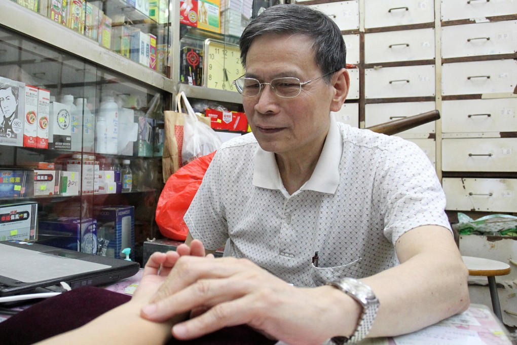 Wong Hok-yee, a Chinese medicine practitioner for 30 years, said the Watsons outlet near his tiny clinic has had no impact on his patients. Photo: May Tse