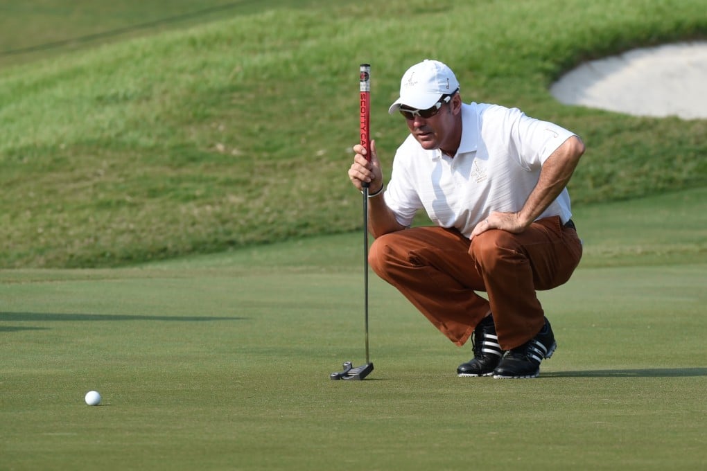 Rich Beem lines up a putt during the second round of the Hong Kong Open at Fanling. Photo: Richard Castka