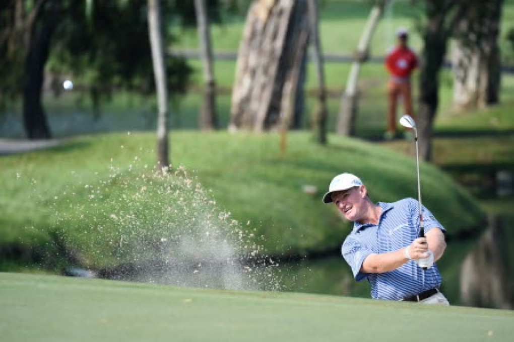 Ernie Els chips onto a green. Photo: Richard Castka