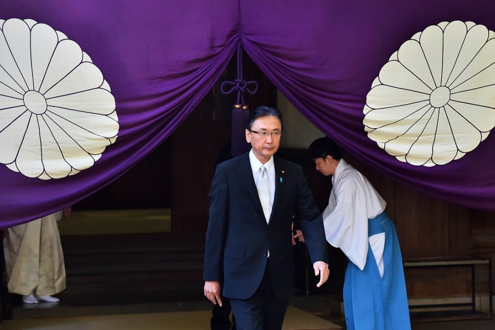 Japanese former state minister Keiji Furuya leaves the Yasukuni shrine on Friday. More than 100  lawmakers visited the shrine condemned by China and Korea as a symbol of Japan's militarist past. AFP