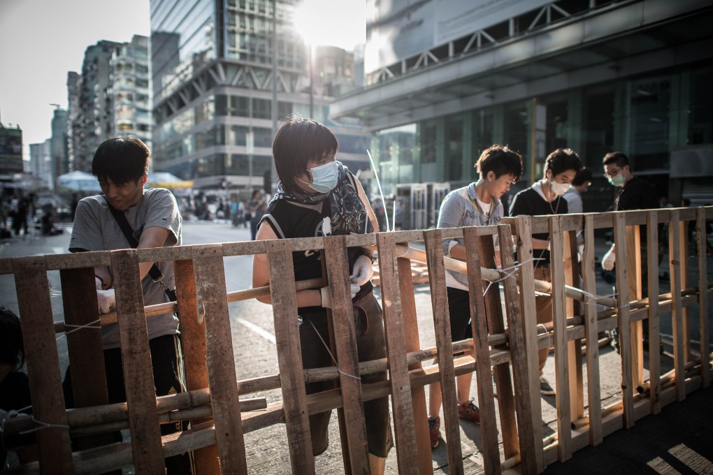 Pro-democracy protesters reinforce a barricade in Mong Kok. Photo: AFP