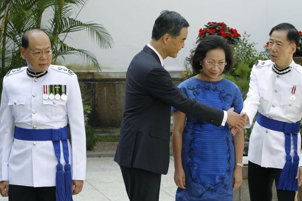 Andy Tsang, Leung Chun-ying and his wife, Regina Leung Tong Ching-yee, and Deputy Police Commissioner Tony Wong Chi-hung at the Bauhinia Awards ceremony yesterday. Photo: SMP
