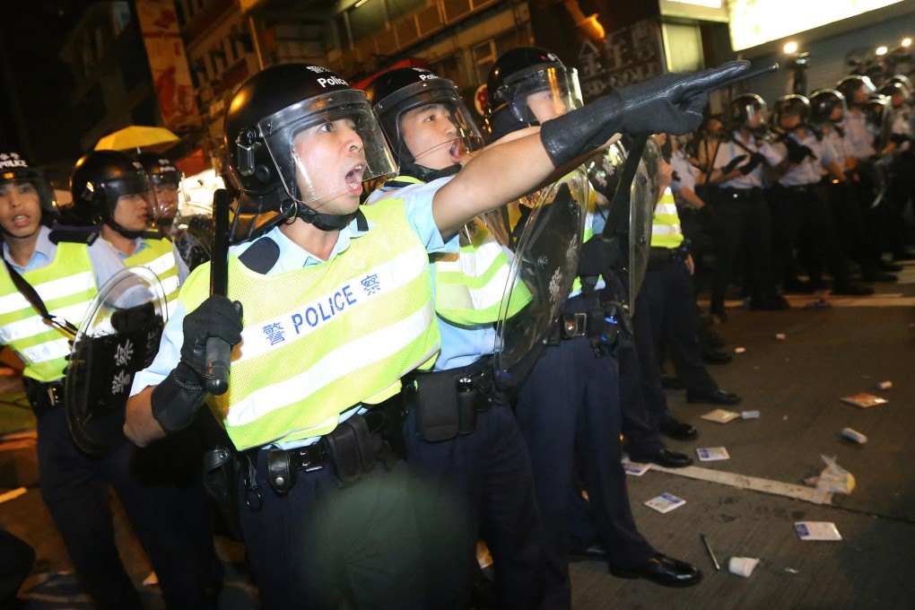 A 23-year-old man was arrested for an online post that encouraged people to charge police during Occupy protests. Photo: Sam Tsang