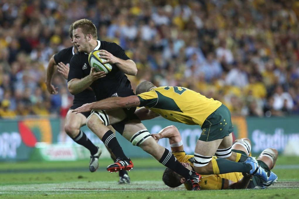 New Zealand's Sam Cane is tackled by Matt Hodgson of Australia during their Bledisloe Cup clash in Brisbane on Saturday. Photos: AP