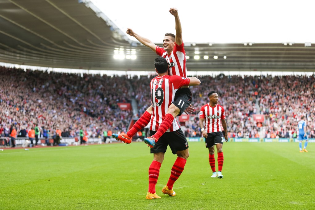 Southampton's Graziano Pelle celebrates his team's fifth goal with Dusan Tadic at St Mary's Stadium. Photos: AP