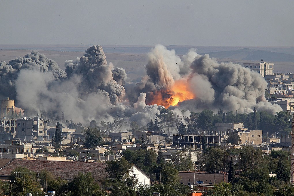 Smoke rises after an US-led coalition airstrike on Kobane, Syria on Saturday. Photo: EPA