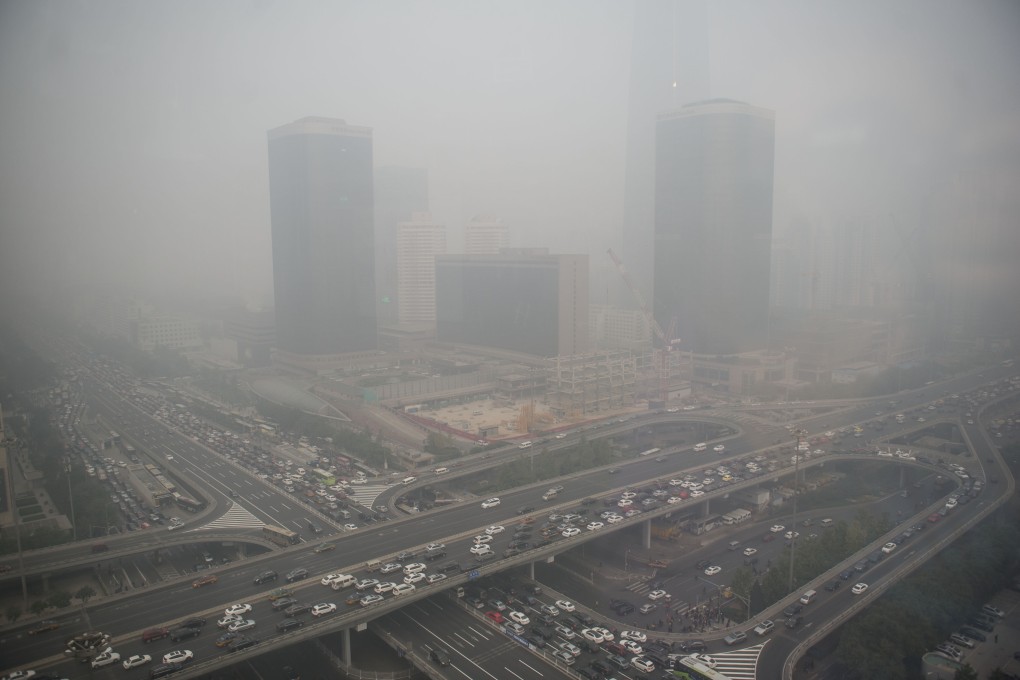 Smog shrouded buildings and streets in Beijing, China. Photo: Xinhua