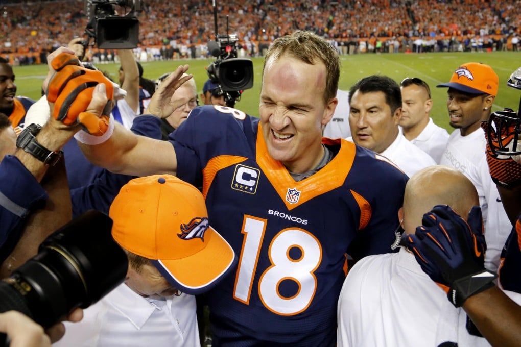 Denver Broncos quarterback Peyton Manning celebrates his 509th career touchdown pass with teammates during the first half against the San Francisco 49ers in Denver. Photos: AP