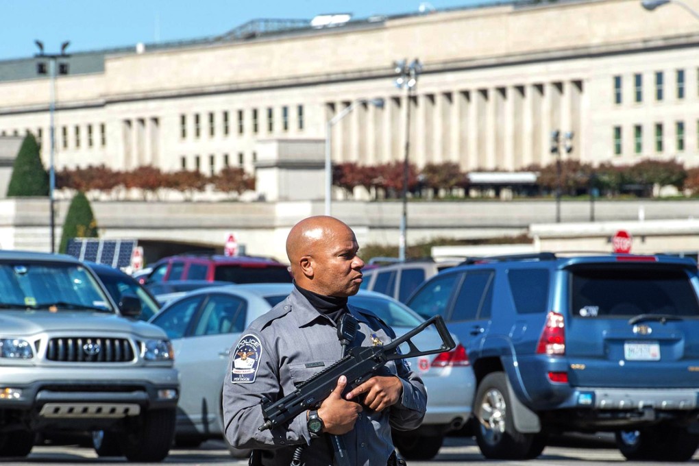 Ebola fears are prompting scares, including a police operation at the Pentagon (above) after a woman vomited in a car park. Photo: AFP