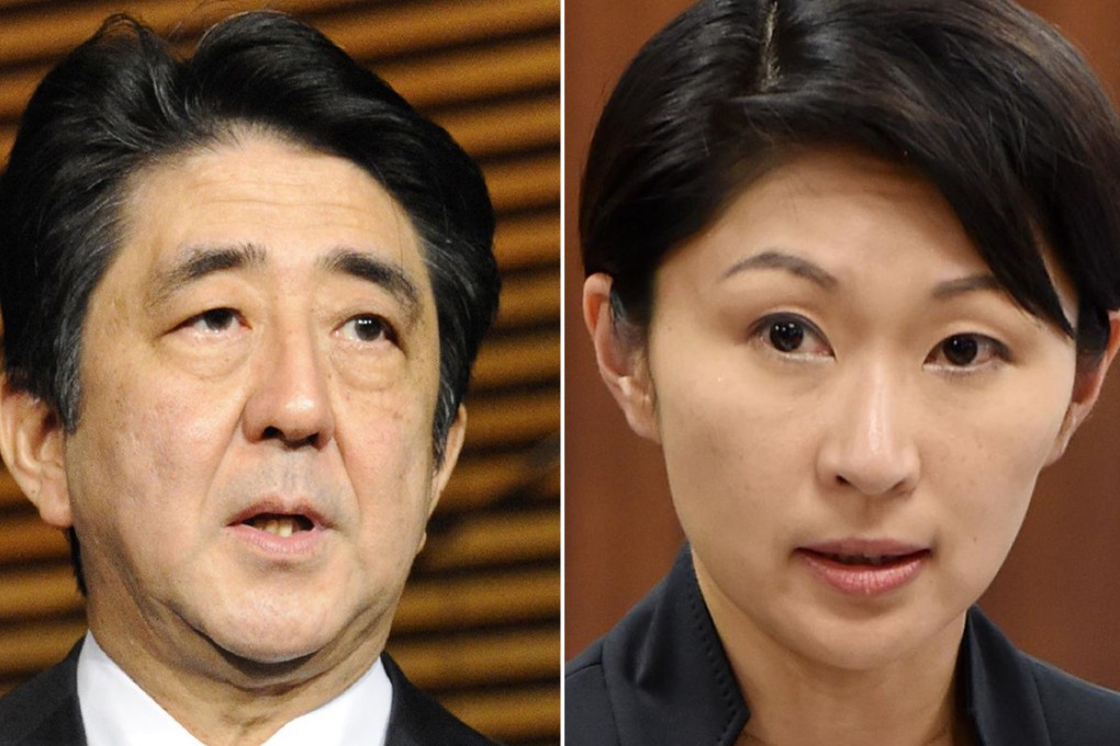Shinzo Abe and Yuko Obuchi. Photos: AFP