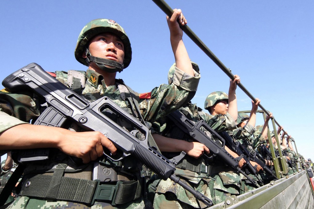 An anti-terrorism force including public security police and the armed police attend an anti-terrorism joint exercise in China's restive Xinjiang region. Photo: AFP