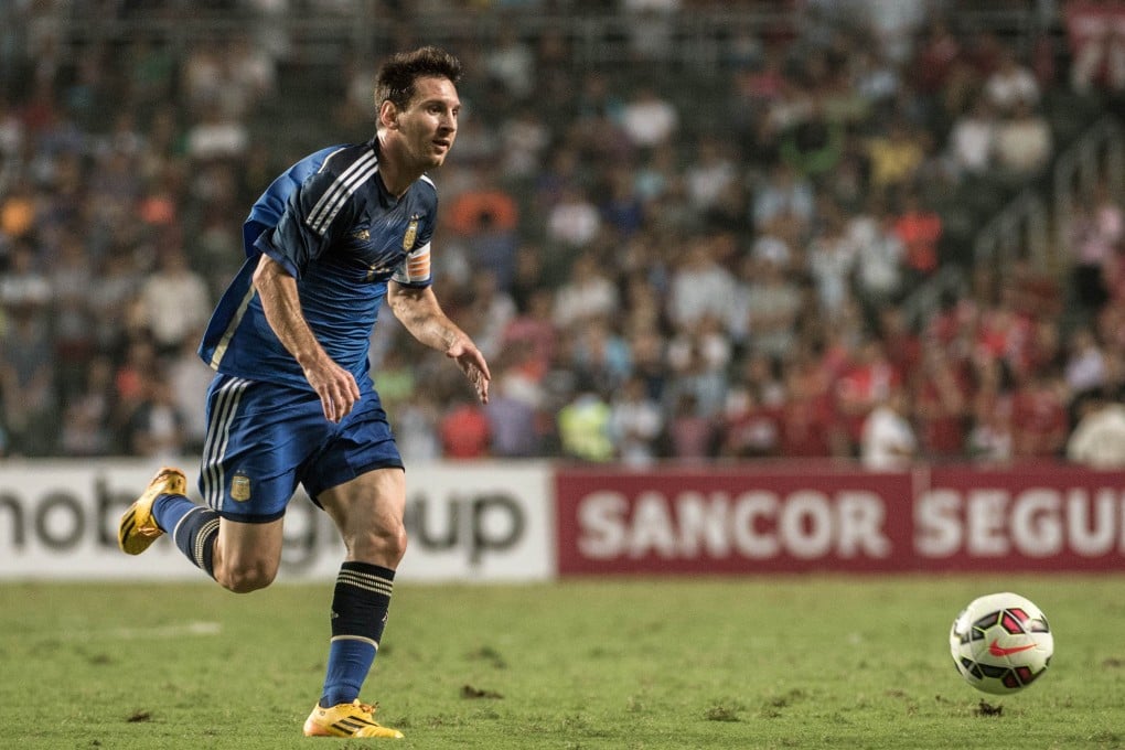 Lionel Messi weaves his magic during Argentina's friendly game against Hong Kong. But even his presence couldn't fill Hong Kong Stadium. Photo: AFP