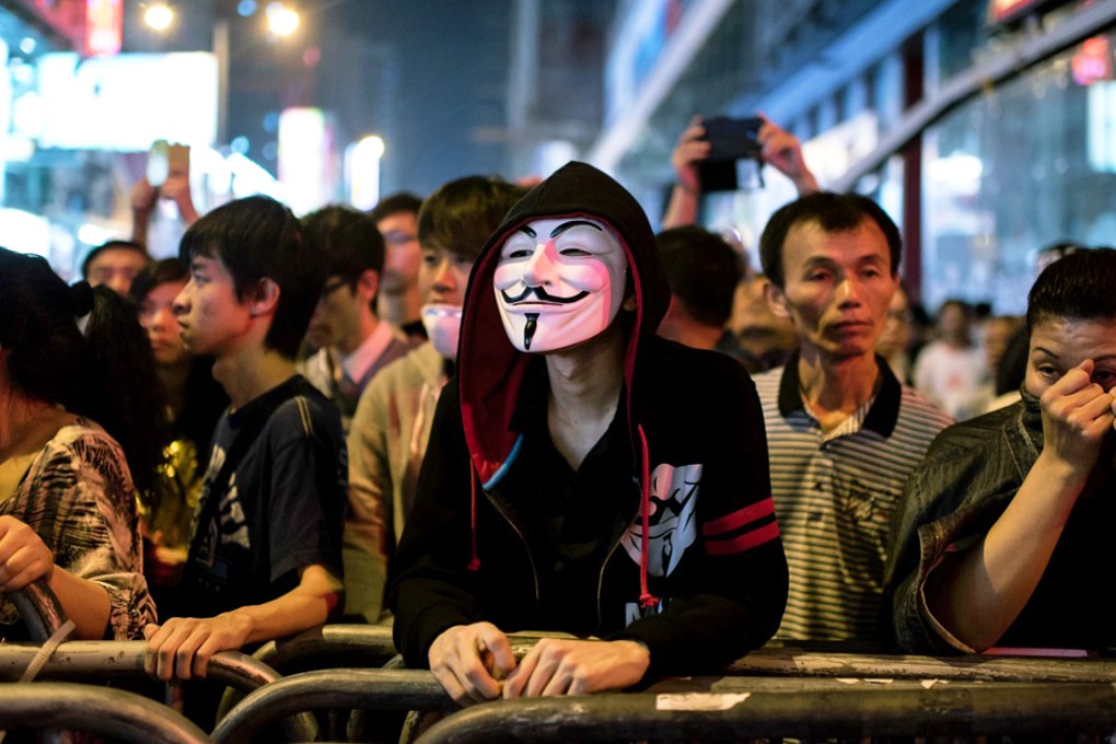 A protester in Hong Kong wearing a Guy Fawkes mask. Supporters of the Anonymous movement have adopted the mask as their emblem. Photo: AFP
