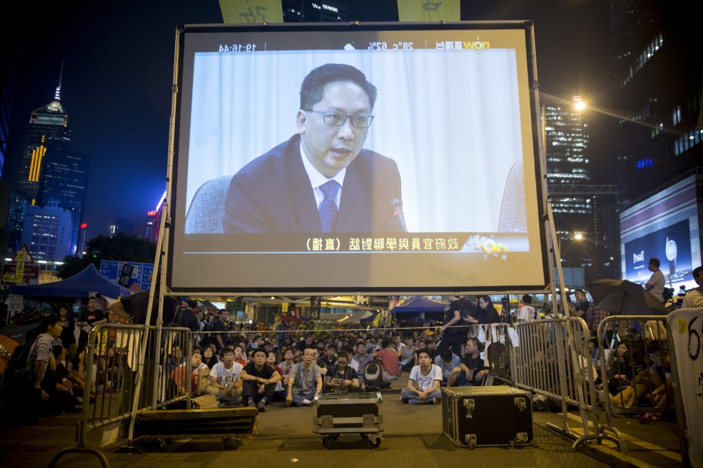 Protesters and other members of the public gave a thumbs down to yesterday's televised two-hour talks between top officials and student leaders. Photo: Bloomberg