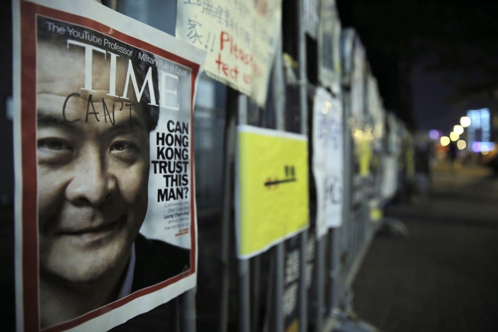 A Time magazine cover featuring Hong Kong's Chief Executive Leung Chun-ying posted by pro-democracy protesters outside the gate of government headquarters in Admiralty. Photo: AP