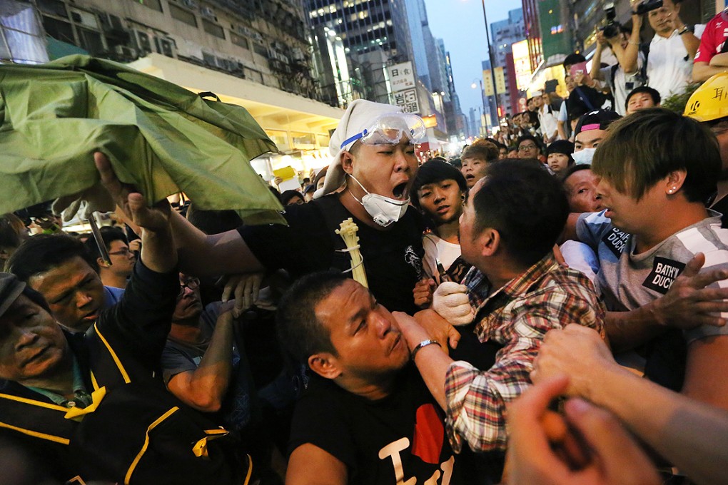 Scuffles break out between Occupy protesters and opponents in Mong Kok. Photo: Sam Tsang