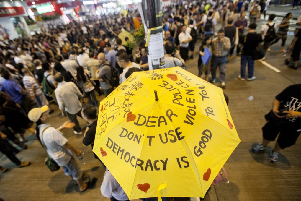 Pro-democracy protesters gather to discuss politics in the street in Mong Kok. Photo: EPA