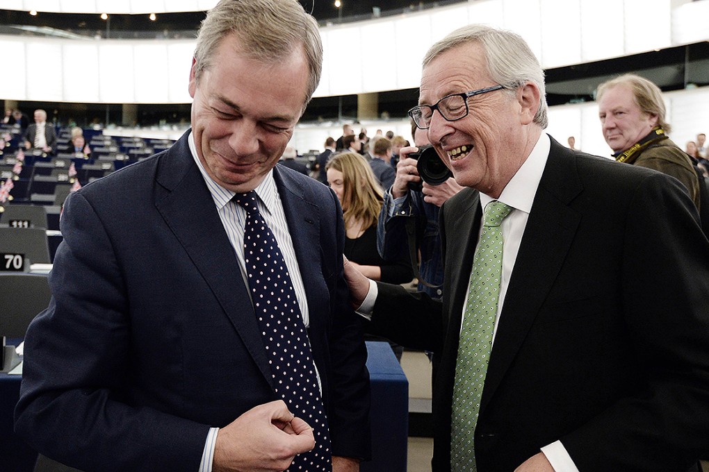 EC President Jean-Claude Juncker (right) shares a joke with Britain's UKIP leader Nigel Farage in Strasbourg. Photo: AFP
