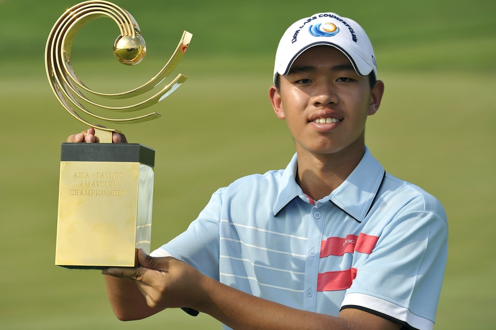 Guan Tianlang poses with the winner's trophy at the Asia-Pacific Amateur Championship at Amata Spring Country Club, in Chonburi,Thailand, in 2012. Photo: AP