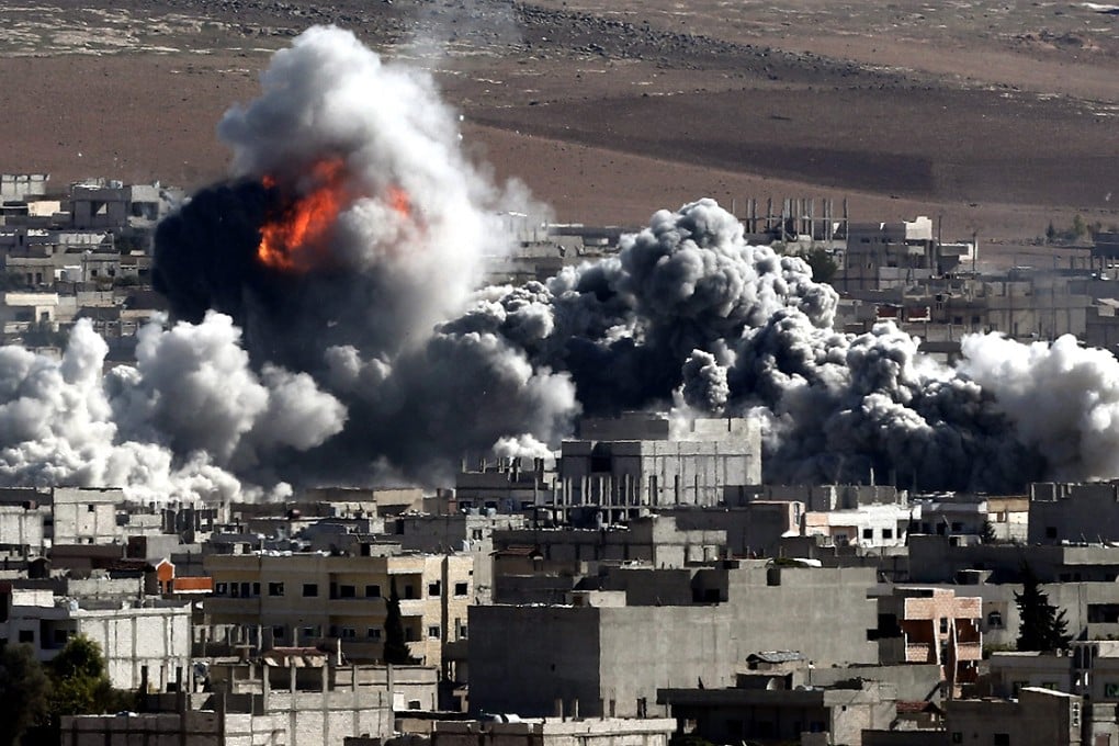 An explosion after an apparent US-led coalition airstrike on Kobane, Syria, as seen from the Turkish side of the border on Wednesday. Photo: EPA