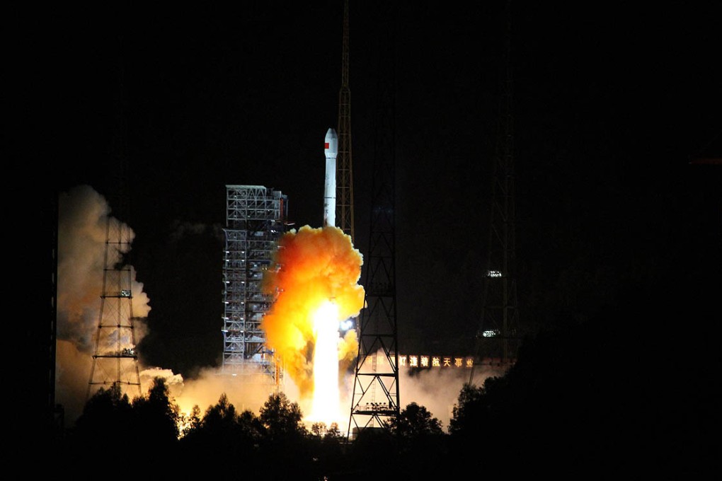 A rocket carrying the spacecraft launches from Xichang space base in Southwest China on Friday. Photo: AFP