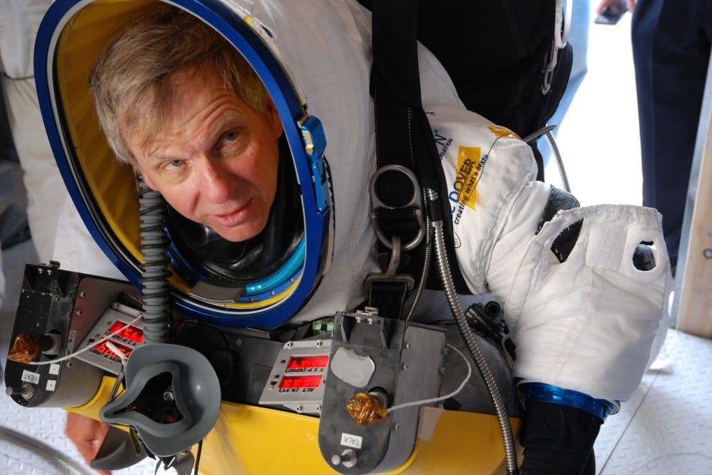 Daredevil Alan Eustace tests the thermal spacesuit ahead of Friday's record-breaking freefall leap from the edge of space. Photo: AP