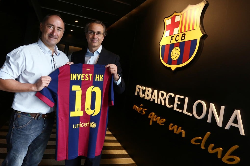 InvestHK chief Simon Galpin welcomes Barcelona vice-president Javier Faus for the official opening of the soccer club's Asian offices. Photo: Jonathan Wong