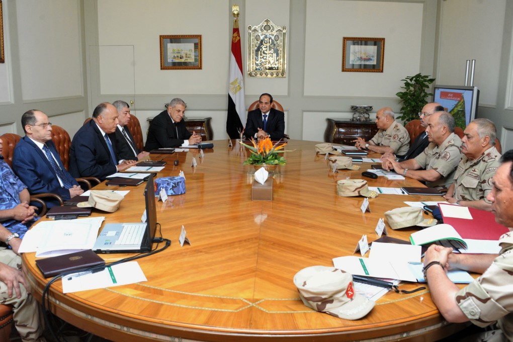 Egypt's President Abdel-Fattah el-Sisi (centre) holds an emergency meeting of the National Defence Council after the Sinai Peninsula attack on Friday. Photo: AP