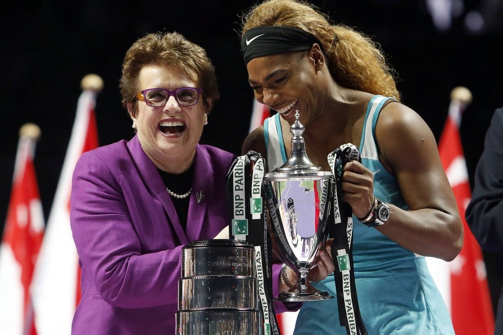 Tennis legend Billie Jean King presents Serena Williams with the trophy after Williams beat Simona Halep in the WTA Finals in Singapore. Photo: Reuters