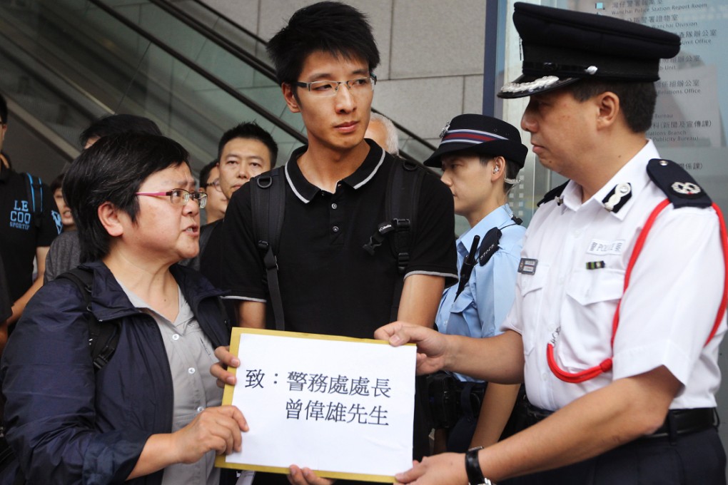 HKJA's Sham Yee-lan and Erik Mak Ka-wai of RTHK hand in the petition. Photo: Edward Wong