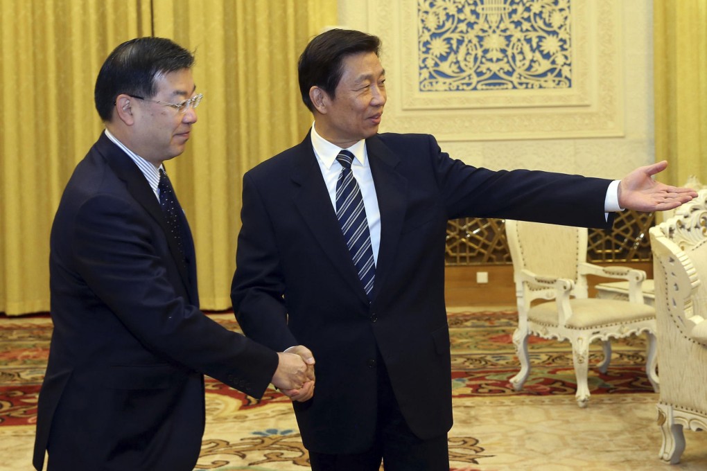 Vice-President Li Yuanchao (right) with Keiji Yamada, president of Japan's National Governors' Association. Photo: AP