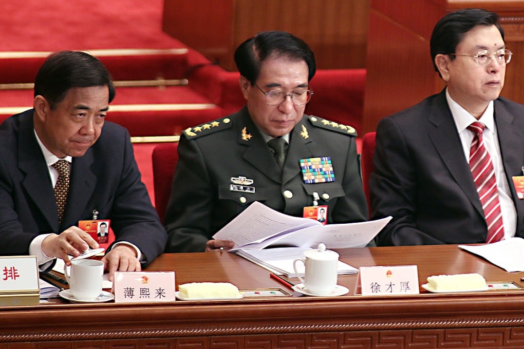 Bo Xilai (left), Xu Caihou (centre) and Zhang Dejiang attend the opening of the Fifth Session of the 11th National People's Congress in Beijing in 2012. Photo: Simon Song