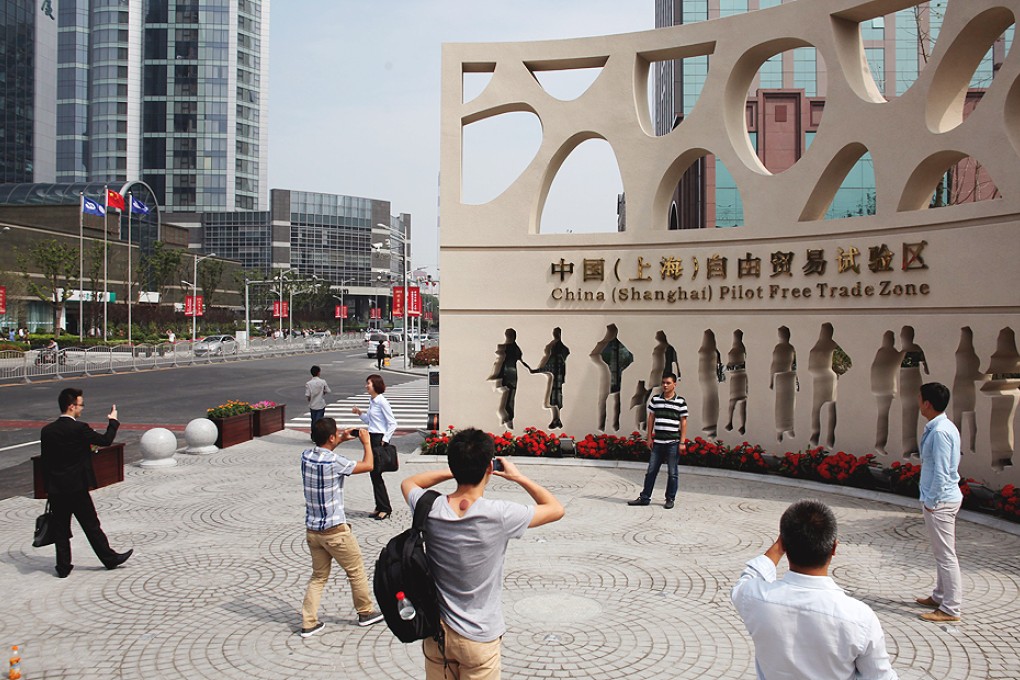 President Xi Jinping said lessons learned after more than a year of operating the FTZ in Shanghai could be applied to other areas. Photo: EPA