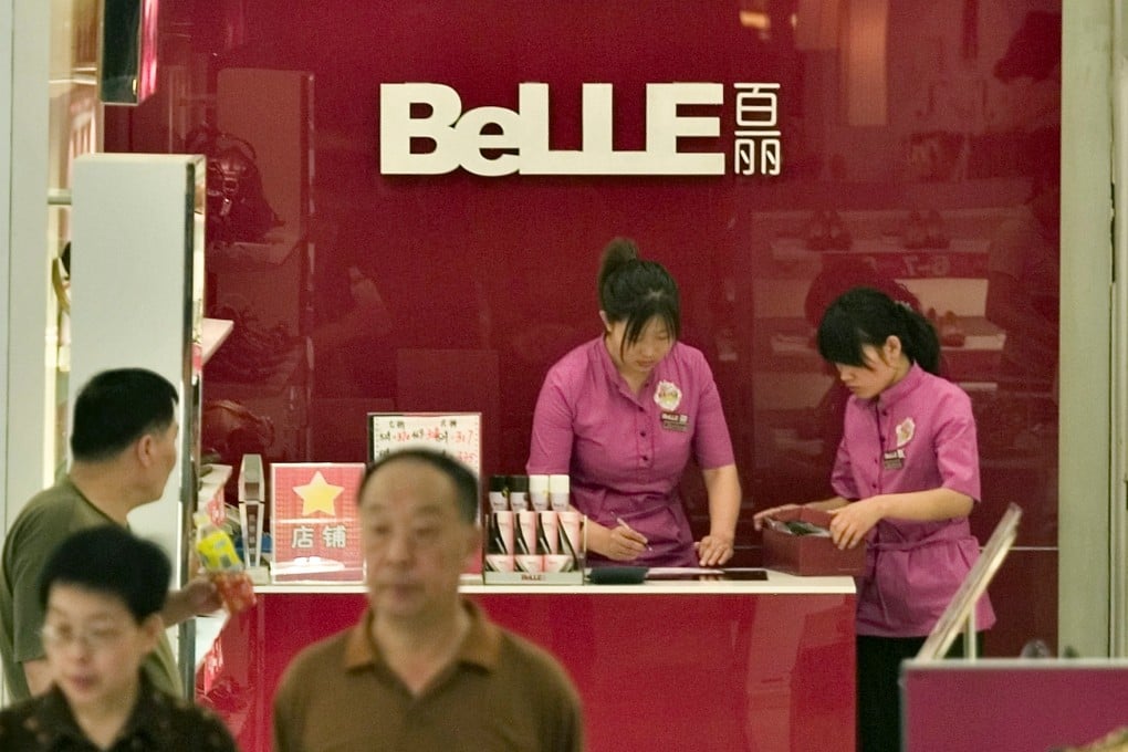 People shop at a Belle International  shoe store in Beijing. Photo: Bloomberg