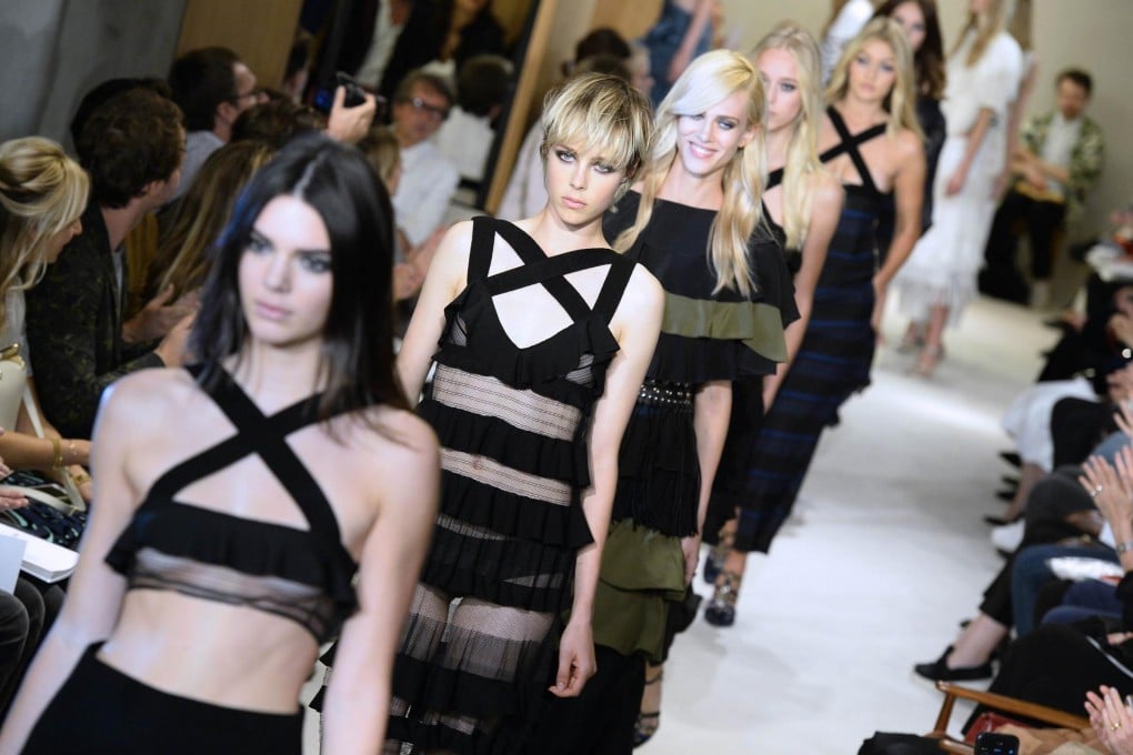 Kendall Jenner and Edie Campbell (first and second in line) model looks from Sonia Rykiel's spring-summer 2015 ready-to-wear collection.