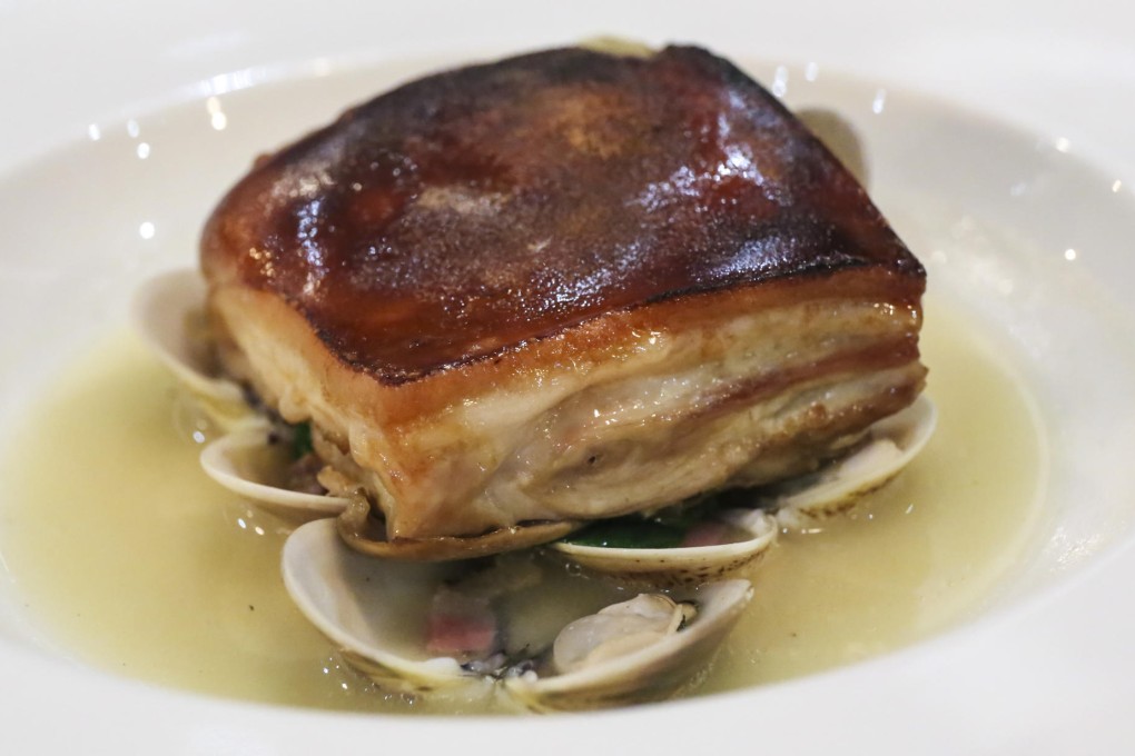 Bryan Nagao's suckling pig, clams, pancetta, baby spinach and miso broth at Town restaurant. Photo: Peter Chang