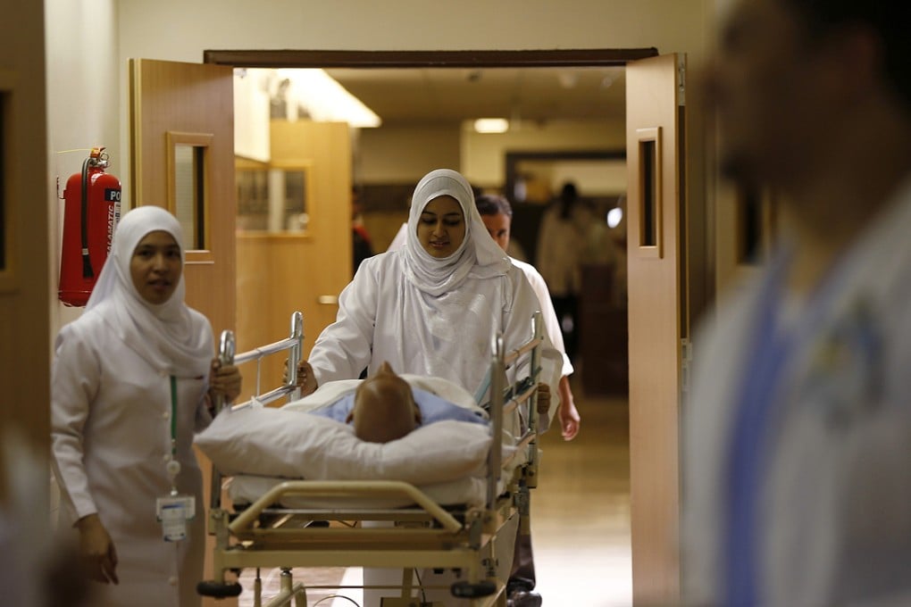 Nurses wheel a patient into the emergency department at Al-Noor Specialist Hospital in Mecca. Photo: Reuters