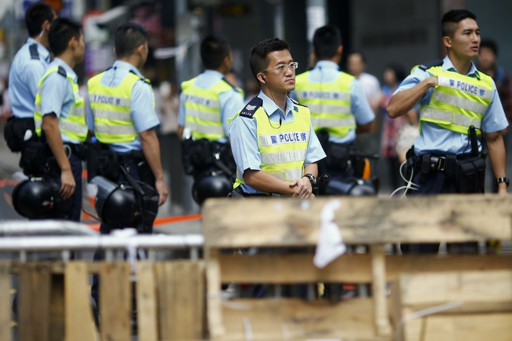 Police take their position at the Occupy site in Mong Kok. Photo: Reuters
