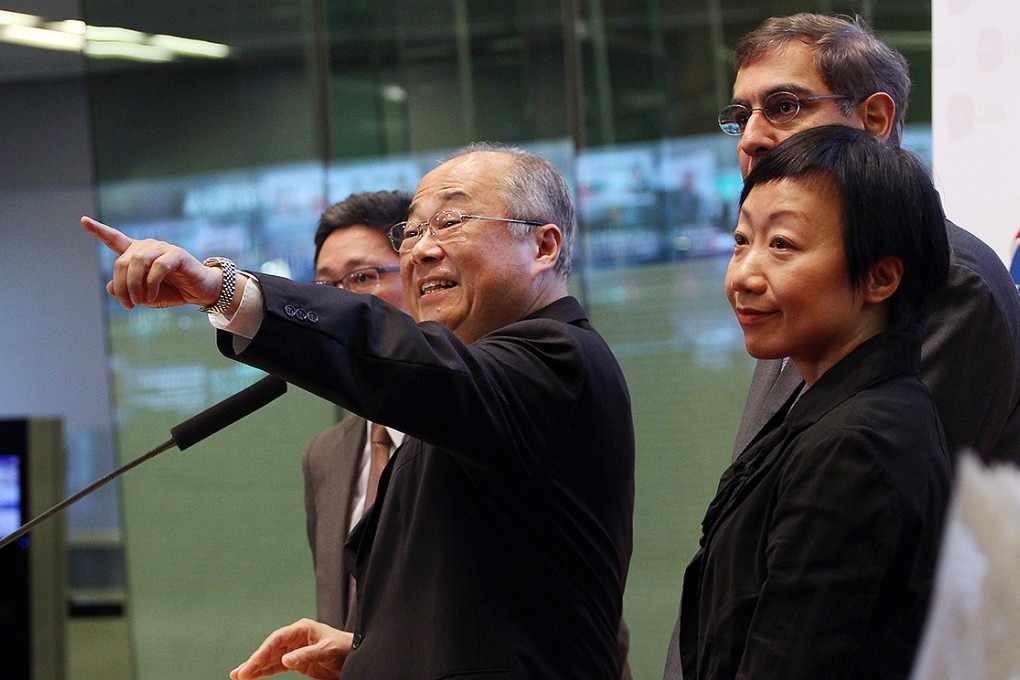 Hong Kong Exchanges & Clearing Chairman Chow Chung-kong (left) makes a statement on the establishment of the Shanghai-Hong Kong stock market link in April. Photo: Felix Wong