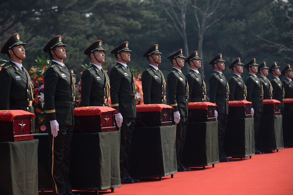 Soldiers accompany the remains of Chinese People's Volunteer Army soldiers who died in the Korean War during a burial ceremony in Shenyang on Wednesday. Photo: Xinhua