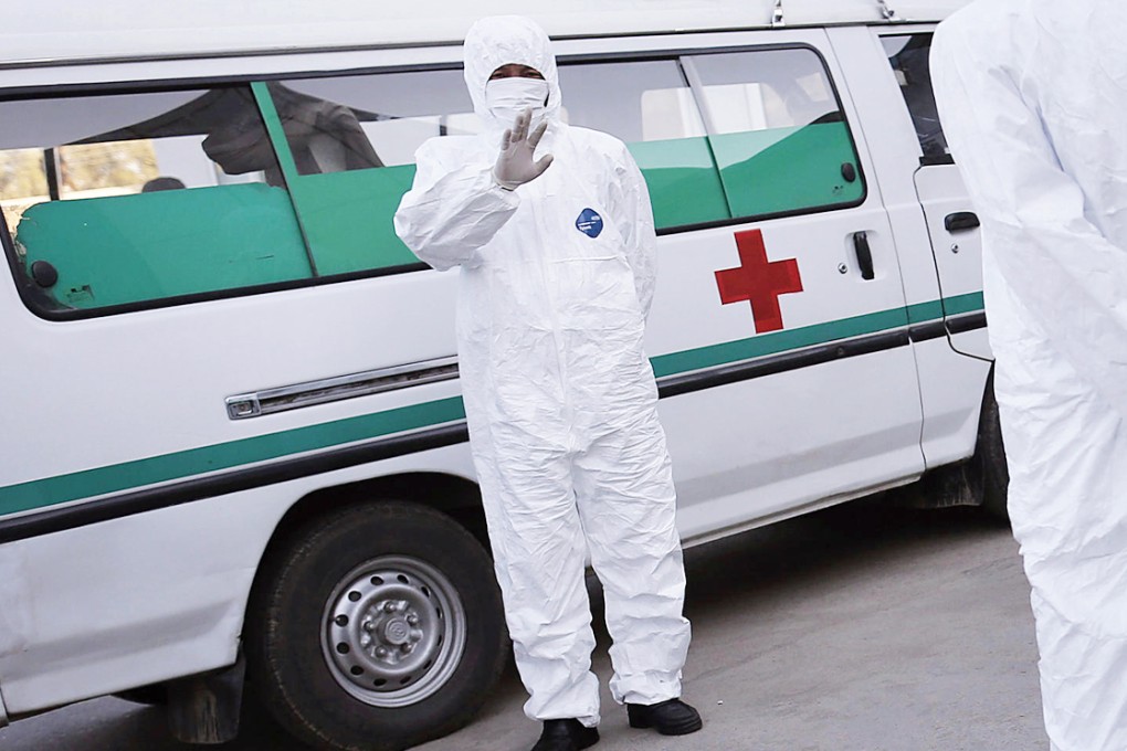 Medical staff stand ready at Pyongyang's airport. Photo: AP