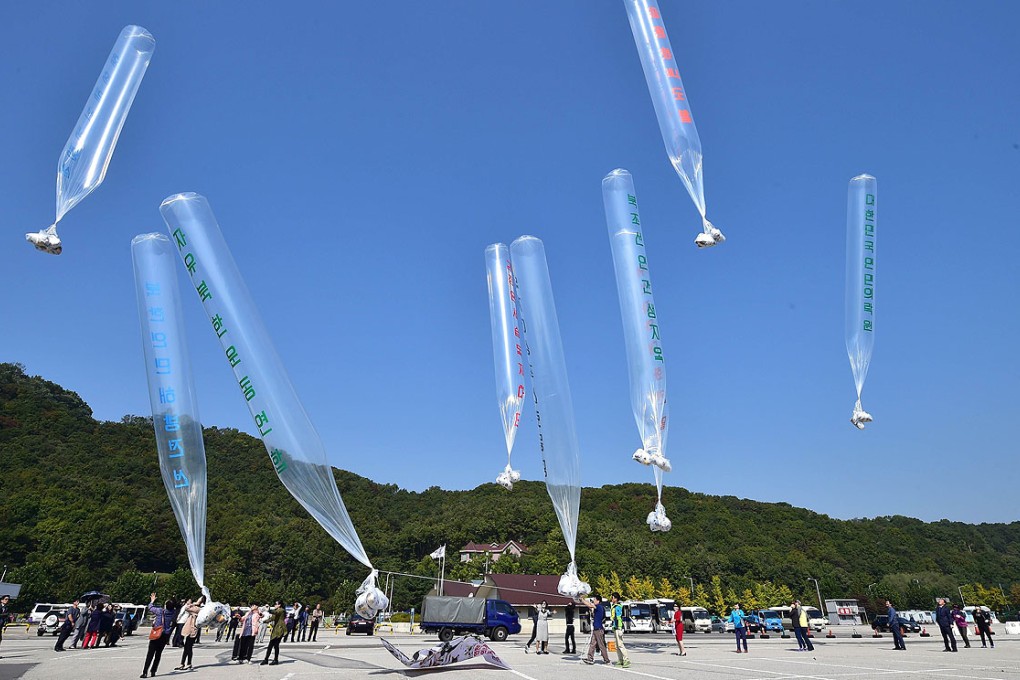 South Korean activists release balloons carrying anti-North Korea leaflets at a park near the inter-Korea border in Paju, north of Seoul. Photo: AFP