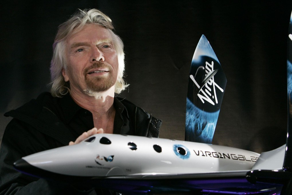 Richard Branson with a model of SpaceShipTwo. Photo: AFP