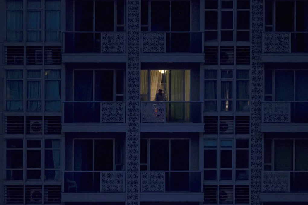 A policeman checks the crime scene in which the bodies of two women were found in a flat in Wan Chai. Photo: Reuters
