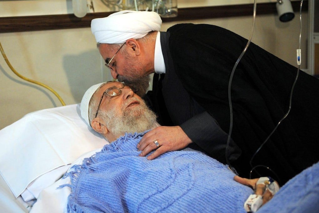 President Hassan Rowhani kisses Ayatollah Khameneion a hospital visit. Photo: EPA