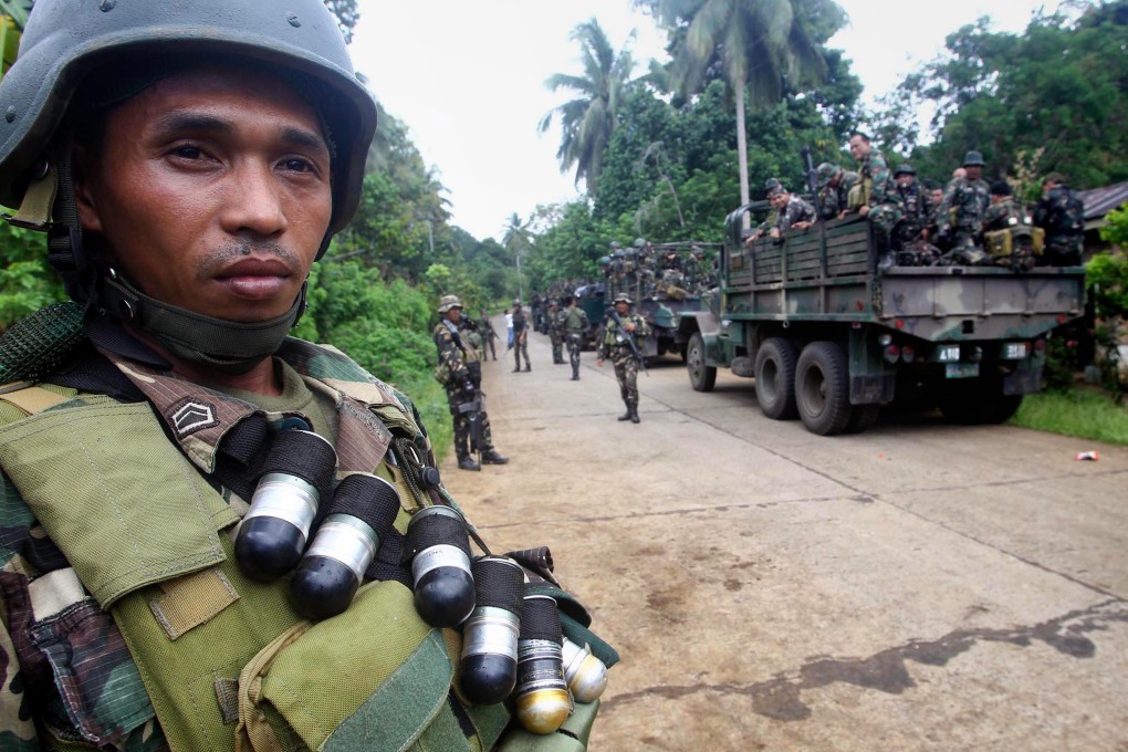 Filipino soldiers deployed near the Abu Sayyaf camp earlier this month. The militant group killed six soldiers, a government spokeswoman revealed. Photo: EPA