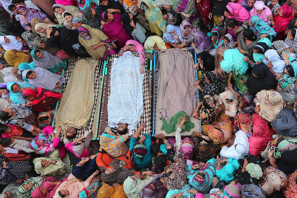 A funeral ceremony for victims of Sunday’s suicide bombing near the border crossing. Photo: EPA