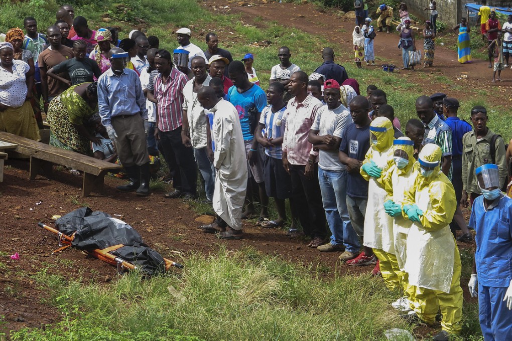 Prayers are made for a victim of Ebola at Owen street in Freetown, Sierra Leone. Photo: EPA